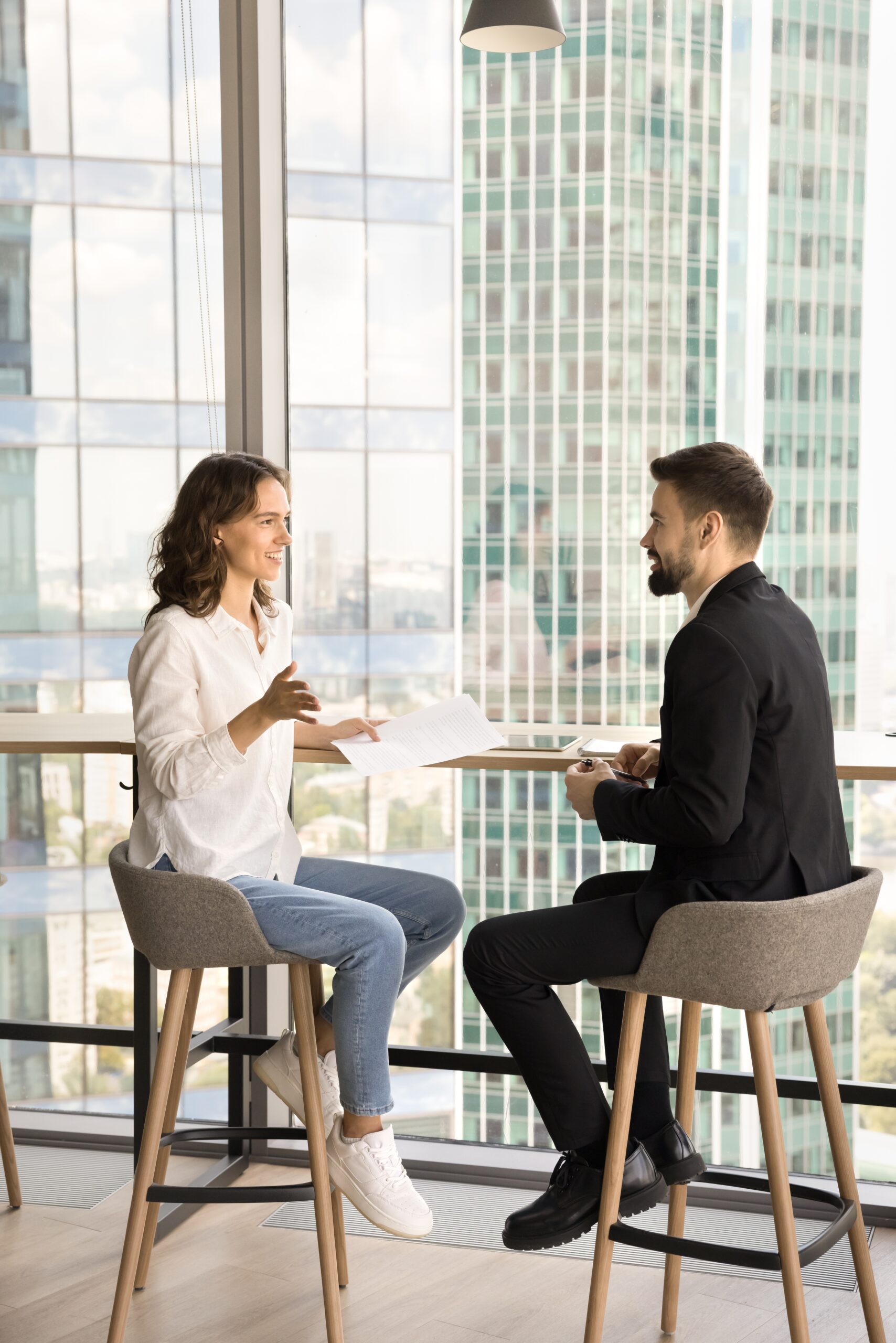 Two,Young,Entrepreneurs,Discussing,Cooperation,In,Co-working,Space,,Talking,At